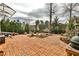 Brick patio perfect for outdoor dining and entertaining with lush landscaping at 800 Glenairy Dr, Atlanta, GA 30328