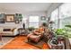 Bright sitting area showcasing plants, a wicker chair, and natural light, offering a serene and inviting atmosphere at 800 Glenairy Dr, Atlanta, GA 30328
