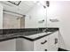 Bathroom vanity featuring a stone countertop and modern fixtures, with a shower/tub combo at 1261 Caroline St # 211, Atlanta, GA 30307