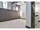 Spacious bedroom with a ceiling fan, modern lighting, and dark accent wall at 1261 Caroline St # 211, Atlanta, GA 30307