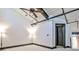 Bright bedroom features high ceilings, modern lighting, and ceiling fan at 1261 Caroline St # 211, Atlanta, GA 30307