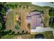 Aerial view of an estate featuring a sprawling lawn and an outdoor entertainment area at 1433 Henderson Ridge Ln, Loganville, GA 30052