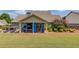 Charming backyard with covered patio, hot tub, and outdoor seating area at 1433 Henderson Ridge Ln, Loganville, GA 30052