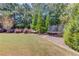 Spacious backyard featuring a hammock and a trampoline, perfect for outdoor fun at 1433 Henderson Ridge Ln, Loganville, GA 30052