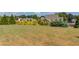 Expansive backyard with lush greenery, landscaping, and neighboring rooftops visible at 1433 Henderson Ridge Ln, Loganville, GA 30052