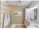 Bathroom with a modern design with white cabinets, a double sink, and a glass shower at 1433 Henderson Ridge Ln, Loganville, GA 30052