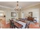 Formal dining room with a chandelier and traditional decor at 1433 Henderson Ridge Ln, Loganville, GA 30052