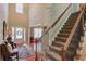 Grand two-story foyer with staircase and a view into the living spaces at 1433 Henderson Ridge Ln, Loganville, GA 30052
