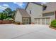 Spacious three-car garage with ample parking space and convenient side entry at 1433 Henderson Ridge Ln, Loganville, GA 30052