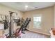 Room with gym equipment, including a treadmill and Bowflex machine at 1433 Henderson Ridge Ln, Loganville, GA 30052