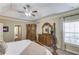 Main bedroom featuring a decorative ceiling, an ornamental dresser, and lots of natural light at 1433 Henderson Ridge Ln, Loganville, GA 30052