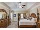 A spacious main bedroom with a ceiling fan and a sitting area at 1433 Henderson Ridge Ln, Loganville, GA 30052