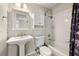 Traditional bathroom with tiled shower, vanity and decorative mirror at 2003 Queen Anne Ct, Sandy Springs, GA 30350