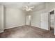 Bedroom with a ceiling fan and access to other rooms at 2003 Queen Anne Ct, Sandy Springs, GA 30350
