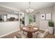Cozy dining area with modern lighting and a view of the backyard at 2003 Queen Anne Ct, Sandy Springs, GA 30350