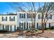 Charming townhome with a well-manicured front yard and a welcoming entrance at 2003 Queen Anne Ct, Sandy Springs, GA 30350