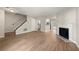 Spacious living area with a fireplace, hardwood floors, and staircase at 2003 Queen Anne Ct, Sandy Springs, GA 30350