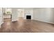 Open-concept living space with fireplace and hardwood flooring at 2003 Queen Anne Ct, Sandy Springs, GA 30350