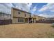 Spacious fenced backyard with a covered patio and outdoor furniture at 117 Jacobs Ln, Loganville, GA 30052