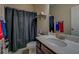 Bathroom featuring a vanity with a white sink, dark curtain, and a toilet at 117 Jacobs Ln, Loganville, GA 30052