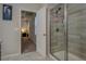 Modern bathroom with a glass-door shower and updated tile flooring at 117 Jacobs Ln, Loganville, GA 30052