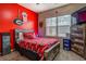 Vibrant bedroom decorated with sports themed bedding and decor at 117 Jacobs Ln, Loganville, GA 30052