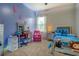 Well-lit bedroom with bright decor and a comfortable bed at 117 Jacobs Ln, Loganville, GA 30052