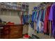 Well-organized walk-in closet with shelves and hanging rods for efficient storage of clothing and shoes at 117 Jacobs Ln, Loganville, GA 30052