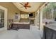 Relaxing covered patio with a ceiling fan, fireplace, and comfortable outdoor seating at 117 Jacobs Ln, Loganville, GA 30052