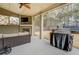 Relaxing covered patio with a ceiling fan, fireplace, grill and comfortable outdoor seating at 117 Jacobs Ln, Loganville, GA 30052