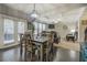 Open dining area showing access to living room, kitchen, outdoor access and coffered ceilings at 117 Jacobs Ln, Loganville, GA 30052