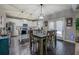 Dining area featuring a wooden table, and access to stainless steel kitchen appliances at 117 Jacobs Ln, Loganville, GA 30052