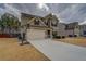 Charming two-story home with a well-manicured lawn and a basketball hoop at 117 Jacobs Ln, Loganville, GA 30052