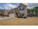 Charming two-story home with a well-manicured lawn and a spacious two-car garage at 117 Jacobs Ln, Loganville, GA 30052