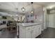 Kitchen island with granite countertops seamlessly connects to dining area and living room at 117 Jacobs Ln, Loganville, GA 30052