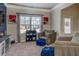 Inviting living room with a large window, cozy seating, stylish decor, and views into the adjacent rooms at 117 Jacobs Ln, Loganville, GA 30052