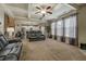 Open-concept living room with large windows, modern furniture, and seamless flow to the kitchen at 117 Jacobs Ln, Loganville, GA 30052