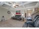 Inviting living room with coffered ceilings, a fireplace, and comfortable reclining seating for a relaxing atmosphere at 117 Jacobs Ln, Loganville, GA 30052