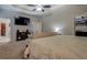 Comfortable main bedroom with a TV and an ensuite bathroom and closet for convenience at 117 Jacobs Ln, Loganville, GA 30052