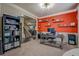 Bright office with a desk, shelving, and view into the adjacent living room, ideal for a productive workspace at 117 Jacobs Ln, Loganville, GA 30052