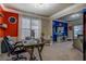 Bright, stylish office with a view of the living room, featuring a desk, a chair and plenty of natural light at 117 Jacobs Ln, Loganville, GA 30052