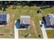 Aerial view of the house showing the roof, driveway, and meticulously maintained landscaping in the neighborhood at 1468 Harlequin Way, Stockbridge, GA 30281