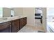 Bathroom featuring double sinks and tiled floors with views of the bedroom at 1468 Harlequin Way, Stockbridge, GA 30281