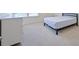 Cozy bedroom with neutral carpet, white walls, and minimalist decor at 1468 Harlequin Way, Stockbridge, GA 30281