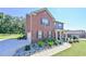Charming two-story brick home featuring an attached garage and well-maintained landscaping at 1468 Harlequin Way, Stockbridge, GA 30281