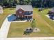 Beautiful two-story brick home with a well-manicured lawn and extended driveway at 1468 Harlequin Way, Stockbridge, GA 30281