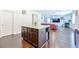 Open-concept kitchen with an island that flows into the living area with a fireplace at 1468 Harlequin Way, Stockbridge, GA 30281