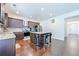 Well-lit kitchen features granite countertops, island seating, and stainless steel appliances at 1468 Harlequin Way, Stockbridge, GA 30281