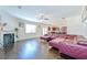 Cozy living room featuring hardwood floors, a fireplace, and seamless access to the kitchen at 1468 Harlequin Way, Stockbridge, GA 30281
