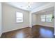 The living room is bright with hardwood floors and lots of natural light at 1468 Harlequin Way, Stockbridge, GA 30281